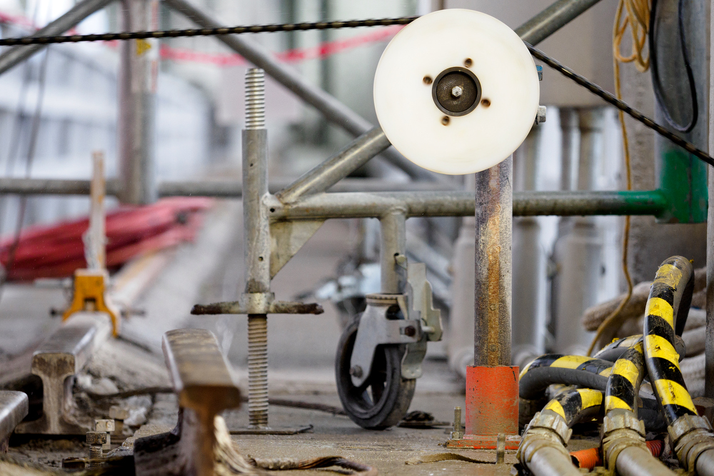 Staff photo by C.B. Schmelter / A steel cable with 15-millimeter diamond beads moves through pulleys and cuts the concrete at the Chickamauga Dam on Friday, Jan. 8, 2021 in Chattanooga, Tenn.
