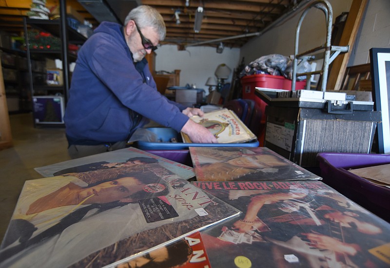 Staff Photo by Matt Hamilton / Bill Slack looks through bins filled with musician Adam Ant's possessions at his home in Hixson on Wednesday, Jan. 6, 2021.