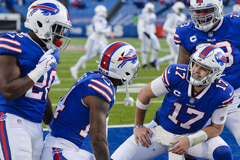 AP photo by Adrian Kraus / Buffalo Bills quarterback Josh Allen (17) celebrates with wide receiver Stefon Diggs, second from left, as teammates Dion Dawkins, right, and Zack Moss look on during Saturday's home playoff game against the Indianapolis Colts. Allen had just completed a 35-yard touchdown pass to Diggs early in the fourth quarter, but the Bills' 24-10 lead wouldn't last long as the Colts tried to rally.
