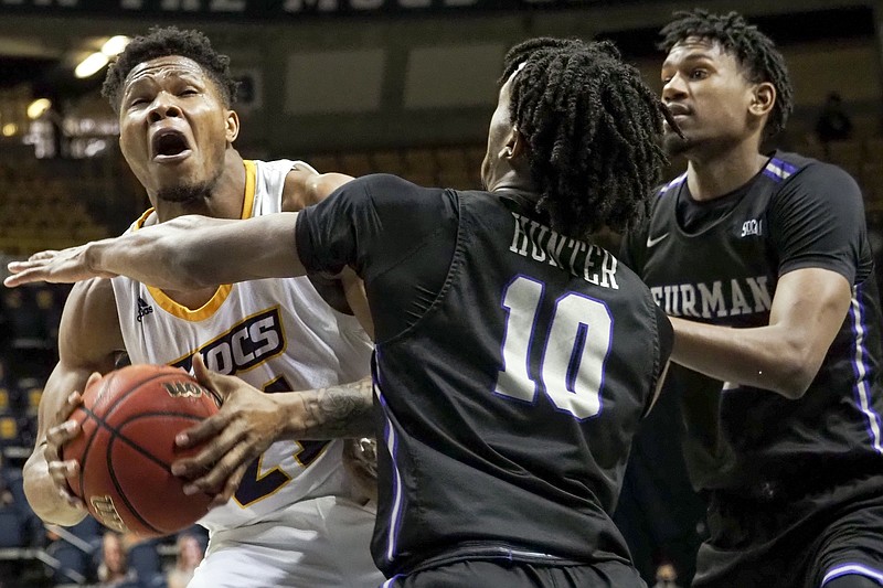 Staff file photo by C.B. Schmelter / UTC forward Josh Ayeni, with ball, had 17 points and seven rebounds during Saturday's SoCon game at The Citadel, but he missed the final 4:04 of the Mocs' 92-87 loss after fouling out.