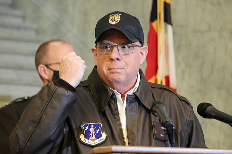 Maryland Gov. Larry Hogan holds his hand up during a news conference in Annapolis, Md., on Thursday, Jan. 7, 2021, as he describes phone conversations he had with Maryland Rep. Steny Hoyer and Secretary of the Army Ryan McCarthy on sending Maryland National Guard members to help protect the U.S. Capitol after rioters stormed the building a day earlier. (AP Photo/Brian Witte)


