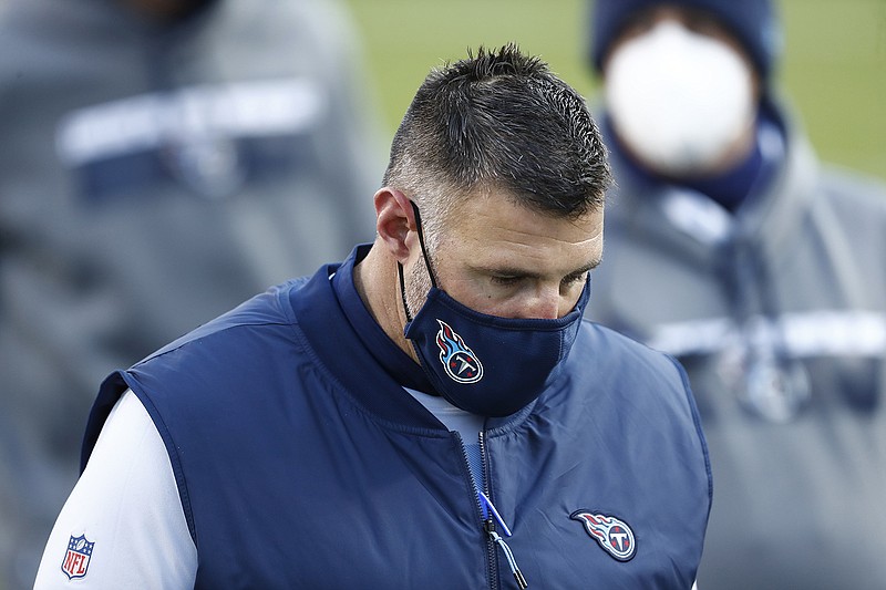 AP photo by Wade Payne / Tennessee Titans coach Mike Vrabel leaves the field after Sunday's home playoff loss to the Baltimore Ravens.