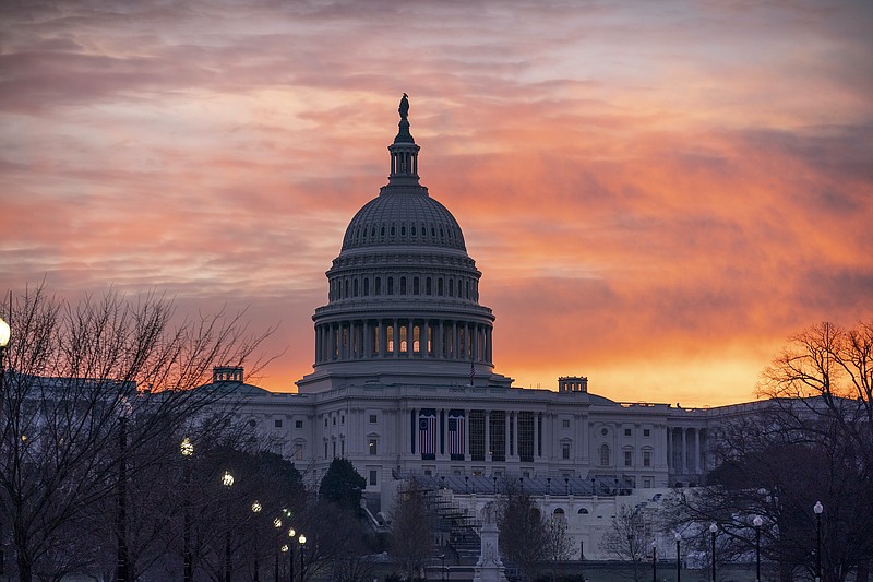 AP Photo by J. Scott Applewhite/Dawn breaks at the Capitol in Washington on Monday, the same day House Speaker Nancy Pelosi, D-California, called for congressional action to rein in President Donald Trump after he incited last week's deadly assault on the U.S. Capitol.