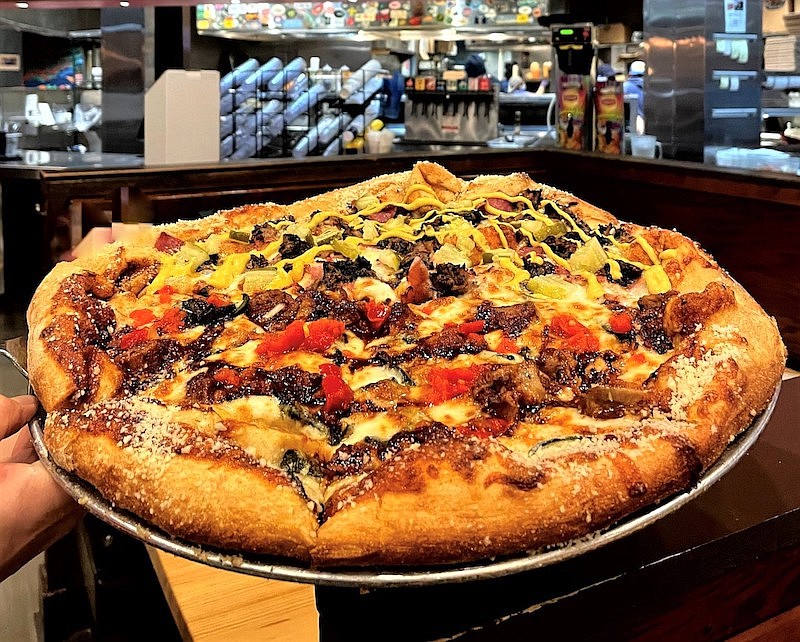 Photo by Anne Braly / Can't decide between the Backyard BBQ and the Wild in Havana, two of the pizzeria's new specialty pies? Order half of one and half of the other in the same pan.