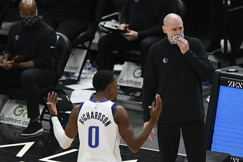 Dallas Mavericks head coach Rick Carlisle and Josh Richardson (0) argue with referees after Richardson was called for a foul during the second half of an NBA basketball game against the Chicago Bulls, Sunday, Jan. 3, 2021, in Chicago. (AP Photo/Paul Beaty)