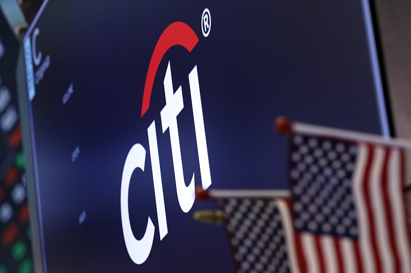 FILE - In this Feb. 8, 2019, file photo, the logo for Citigroup appears above a trading post on the floor of the New York Stock Exchange. Businesses are rethinking political contributions in the wake of the deadly Capitol siege by President Donald Trump's supporters on Wednesday, Jan. 6, 2021. Citigroup confirmed Sunday, Jan. 10, 2021, that it is pausing all federal political donations for the first three months of the year. (AP Photo/Richard Drew, File)