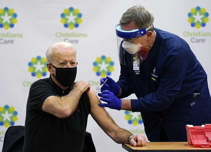 President-elect Joe Biden receives his second dose of the coronavirus vaccine at ChristianaCare Christiana Hospital in Newark, Del., Monday, Jan. 11, 2021. The vaccine is being administered by Chief Nurse Executive Ric Cuming. (AP Photo/Susan Walsh)