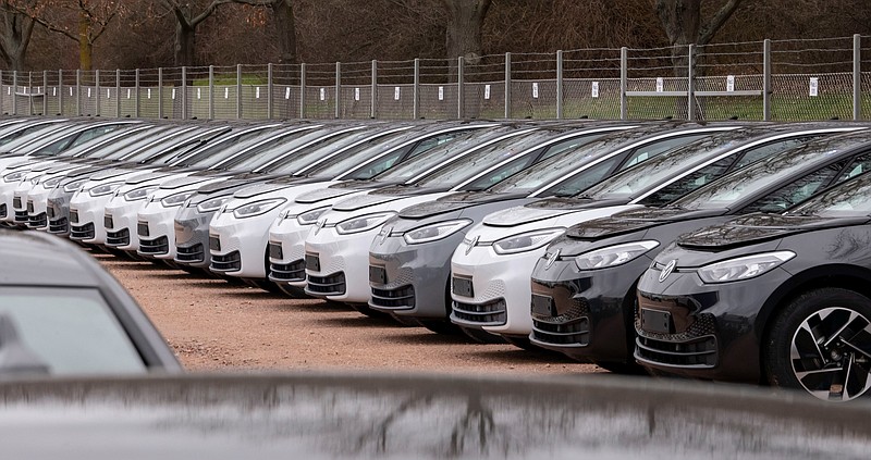 FILE - In this Tuesday, Feb. 25, 2020 file photo, Electric car ID.3 cars stand at the factory area during a press tour at the plant of the German manufacturer Volkswagen AG ,VW, in Zwickau, Germany. Automaker Volkswagen tripled sales of battery-only cars last year as its new electric compact ID.3 came on the market ahead of tough new limits on auto emissions. (AP Photo/Jens Meyer, file)