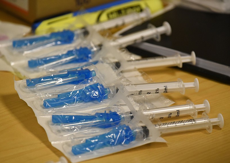 Staff Photo by Matt Hamilton / A row of syringes on the desk of associate health nurse Addie Allen at Hamilton Medical Center in Dalton, Ga. on Monday, Dec. 21, 2020. 