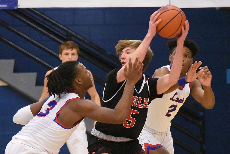 Staff Photo by Matt Hamilton / Red Bank (3) Kel Eddins and (2) Ryan Barber defend as Signal Mountain (5) Benjamin Burns looks for a teammate at Red Bank High School on Tuesday, Jan. 12, 2021. 