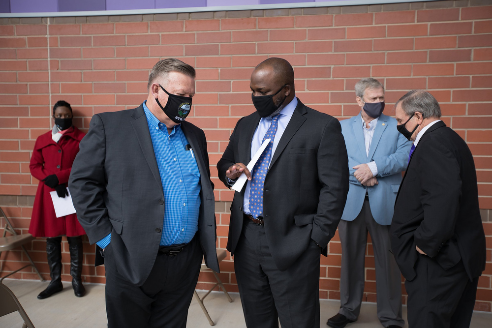 Staff photo by Troy Stolt / Hamilton County Mayor Jim Coppinger Speaks with Hamilton County Schools superintendent Dr. Bryan Johnson during a ribbon cutting ceremony and tour of the new Harrison Elementary School on Tuesday, Jan. 12, 2021 in Harrison, Tenn.