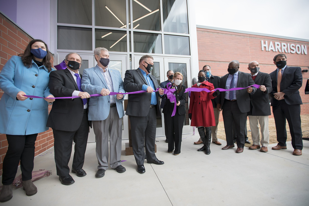Staff photo by Troy Stolt / Interim Principal Jennifer Brownlee cuts a ribbon during a ribbon cutting ceremony and tour of the new Harrison Elementary School on Tuesday, Jan. 12, 2021 in Harrison, Tenn.