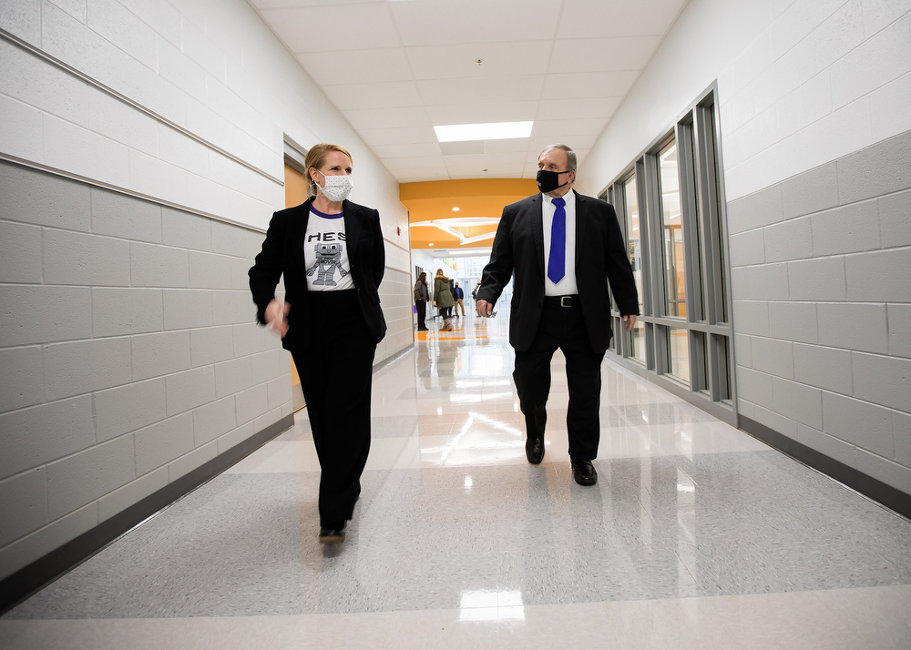 Staff photo by Troy Stolt / Interim Principal Jennifer Brownlee takes Hamilton County School board district 9 representative Dr. Steve Highlander for a tour of the new Harrison Elementary School during a ribbon cutting ceremony and tour on Tuesday, Jan. 12, 2021 in Harrison, Tenn.