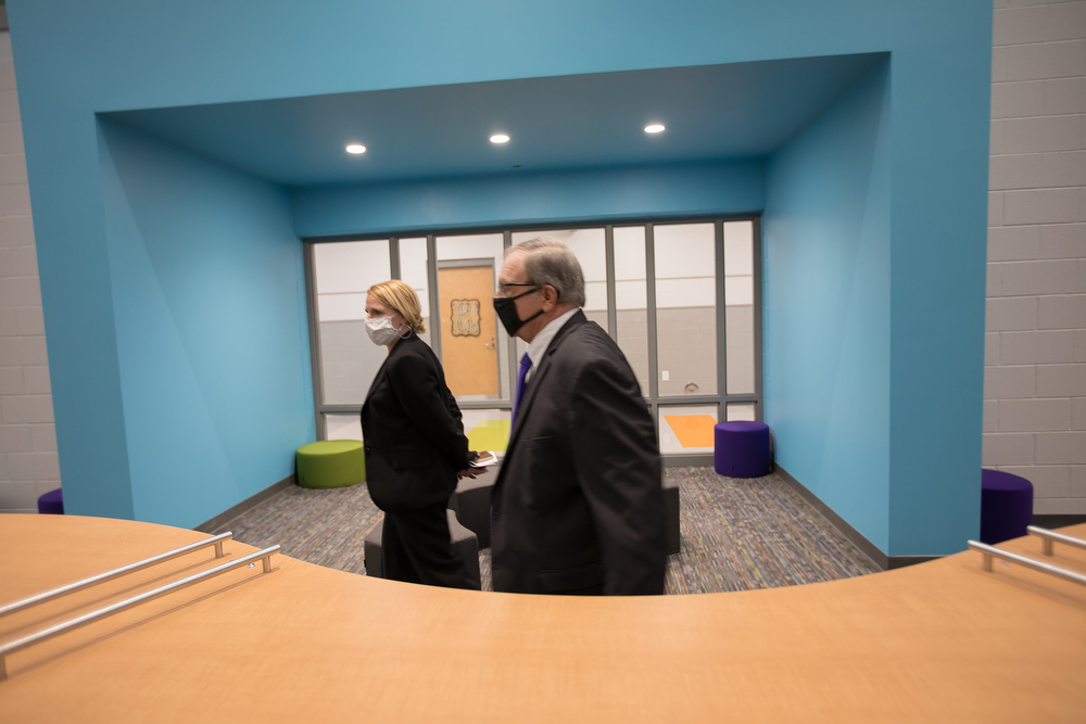 Staff photo by Troy Stolt / Interim Principal Jennifer Brownlee takes Hamilton County School board district 9 representative Dr. Steve Highlander for a tour of the new Harrison Elementary School during a ribbon cutting ceremony and tour on Tuesday, Jan. 12, 2021 in Harrison, Tenn.
