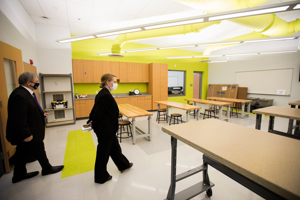 Staff photo by Troy Stolt / Interim Principal Jennifer Brownlee takes Hamilton County School board district 9 representative Dr. Steve Highlander for a tour of the new Harrison Elementary School during a ribbon cutting ceremony and tour on Tuesday, Jan. 12, 2021 in Harrison, Tenn.