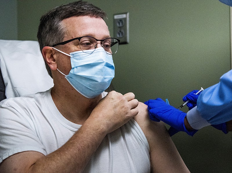Alabama State Health Officer Dr. Scott Harris receives his second COVID-19 vaccine shot at Baptist Medical Center South in Montgomery, Ala., Tuesday, Jan. 12, 2021. (Mickey Welsh/The Montgomery Advertiser via AP)