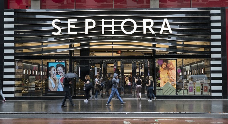 FILE - In this Wednesday, May 16, 2018, file photo, pedestrians walk past a Sephora and Footlocker store in New York. Global beauty retailer Sephora plans to increase diversity in its product offerings and offer more inclusive marketing as part of a wide-reaching plan to combat racially biased shopping experiences and unfair treatment for customers. The plan follows the results of a study that ended in late 2020 commissioned by Sephora that took an in-depth look at racial bias in the U.S. retail shopping experience. (AP Photo/Mary Altaffer, File)