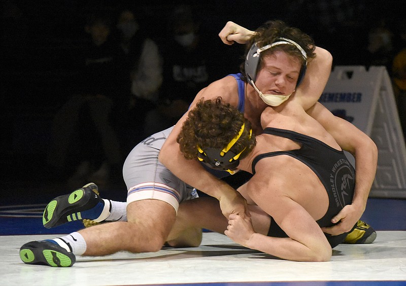 Staff photo by Matt Hamilton / Cleveland's Cody Chittum, left, wrestles Bradley Central's Benjamin Stansberry in the 160-pound bout during Thursday night's matchup of intracounty wrestling rivals at Cleveland High School. Chittum went on to win by pin, helping lead the Blue Raiders to a 51-9 victory.