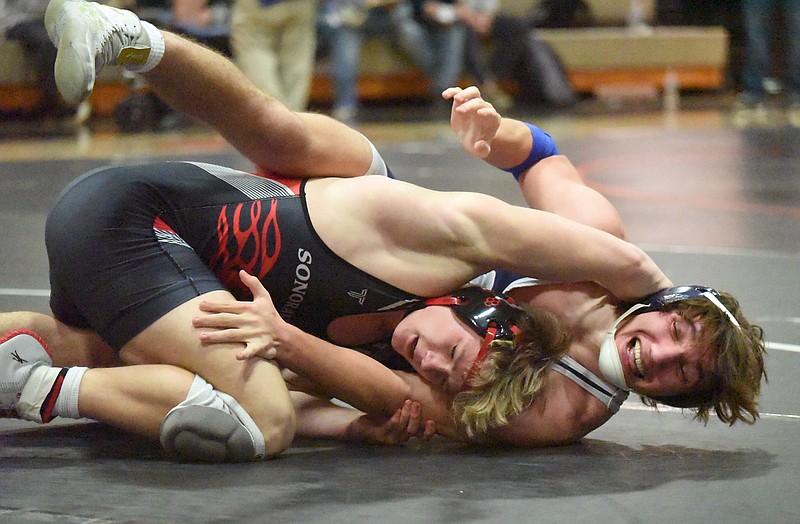 Staff photo by Matt Hamilton / Sonoraville's Colt Weaver, left, wrestles Coahulla Creek's Austin Adams in a 160-pound bout during the GHSA Area 6-AAA duals Friday night at Lafayette High School. Sonoraville won the title to earn the right to host a state duals preliminary next weekend, and Dade County, Northwest Whitfield and Trion will also have that opportunity after winning their respective tournaments Saturday.
