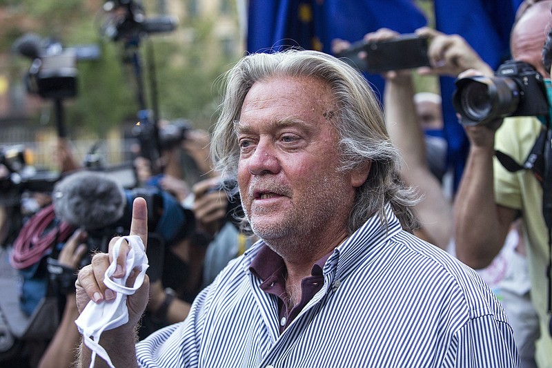 In this Aug. 20, 2020, file photo, President Donald Trump's former chief strategist, Steve Bannon, speaks with reporters in New York after pleading not guilty to charges that he ripped off donors to an online fundraising scheme to build a southern border wall. William A. Burck, a prominent Washington lawyer defending Bannon against the charges, notified a judge on Wednesday, Nov. 25, 2020, that he will no longer be representing Bannon in the case. (AP Photo/Eduardo Munoz Alvarez, File)