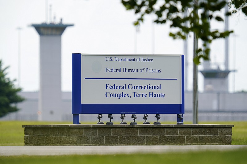This Aug. 28, 2020, file photo shows the federal prison complex in Terre Haute, Ind. Corey Johnson, A federal inmate scheduled to be executed less than a week before President Donald Trump leaves office was a gang member who was sentenced to death for killing seven people in Richmond, Virginia in 1992. Johnson is scheduled to be executed Thursday, Jan. 14, 2021, at the federal prison in Terre Haute. (AP Photo/Michael Conroy, File)
