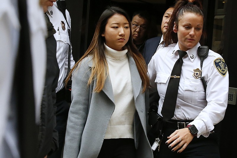 In this Nov. 22, 2019, file photo, Inyoung You leaves Suffolk Superior Court in Boston after pleading not guilty to involuntary manslaughter of Alexander Urtula, who took his own life on the day of his Boston College graduation in May. The manslaughter case against the former Boston College student accused of encouraging her boyfriend, Alexander Urtula, to take his own life will head toward trial, prosecutors said Friday, Jan. 15, 2021. (AP Photo/Michael Dwyer, File)