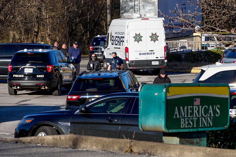 Staff photo by C.B. Schmelter / Hamilton County Sheriff's Office and Chattanooga Police Department officers investigate a shooting at America's Best Inn on Friday, Jan. 15, 2021 in Chattanooga, Tenn.