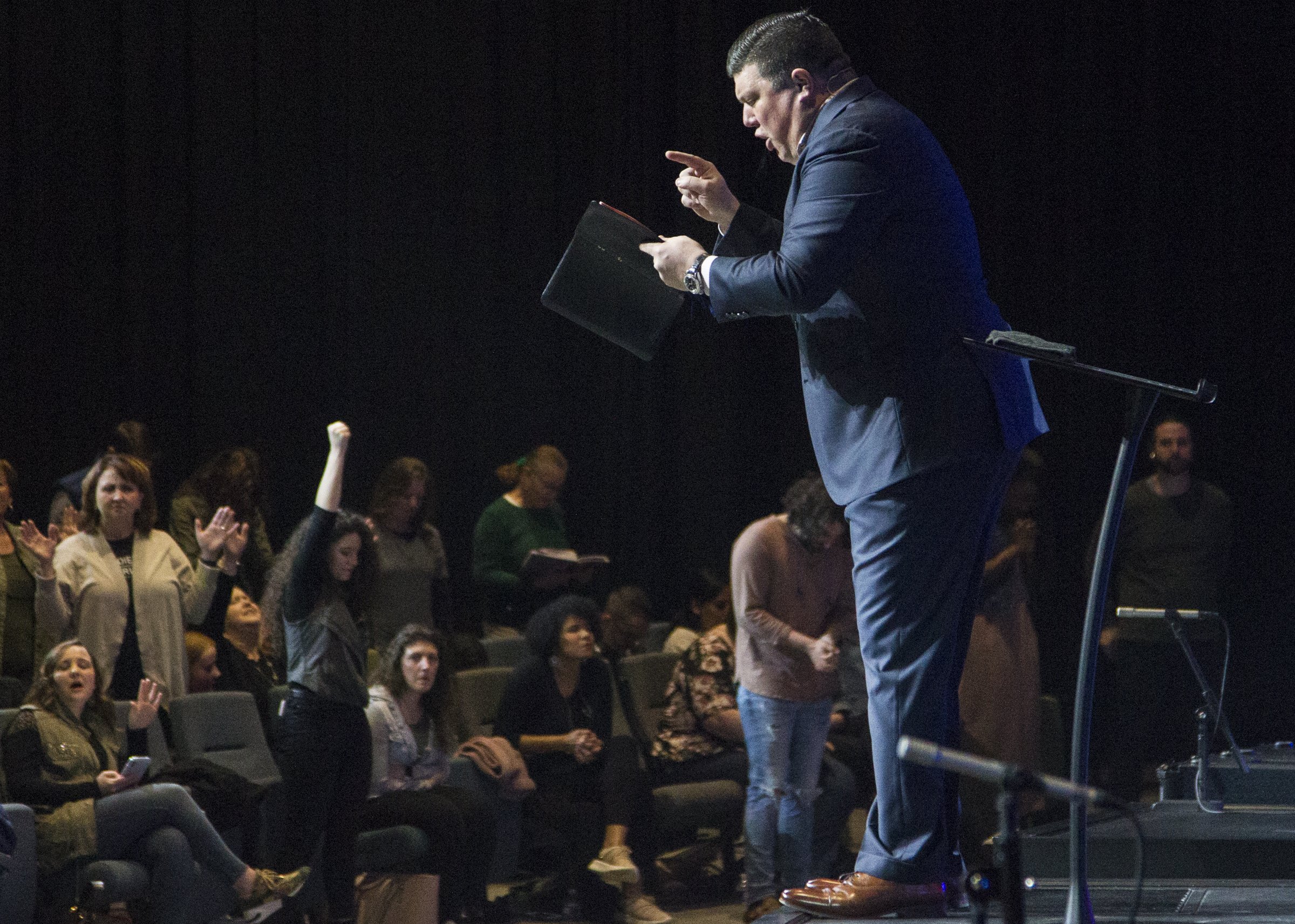 Staff photo by Troy Stolt / Redemption to the Nations church Lead Pastor Kevin Wallace preaches to his congregation about trusting God to help them get through coronavirus (COVID-19) on Sunday, March 15, 2020 in Chattanooga, Tenn.
