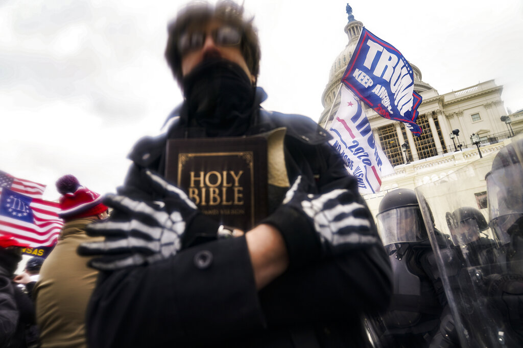 Trump supporters gather outside the Capitol, Wednesday, Jan. 6, 2021, in Washington. (AP Photo/John Minchillo)