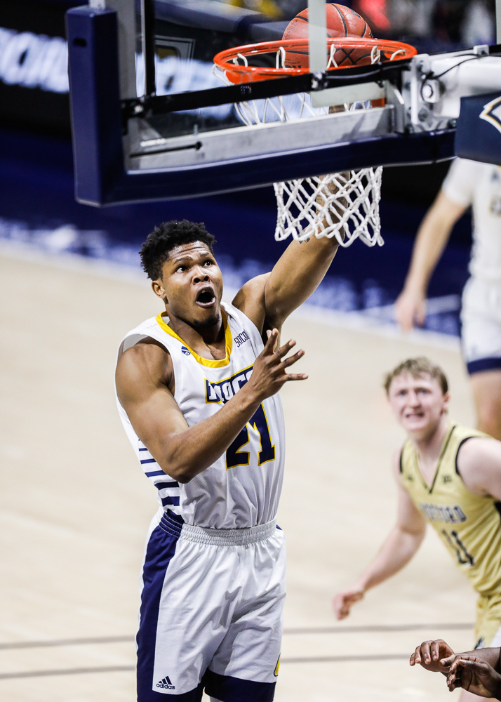 Staff photo by Troy Stolt / Chattanooga Mocs forward Josh Ayeni (21) shoots a layup during the UTC men's basketball game against Wofford at McKenzie Arena on Saturday, Jan. 16, 2021 in Chattanooga, Tenn.