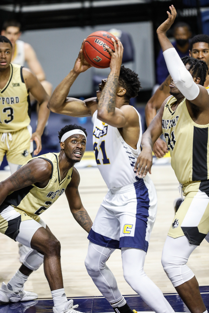 Staff photo by Troy Stolt / Chattanooga Mocs forward Josh Ayeni (21) shoots the ball during the UTC men's basketball game against Wofford at McKenzie Arena on Saturday, Jan. 16, 2021 in Chattanooga, Tenn.
