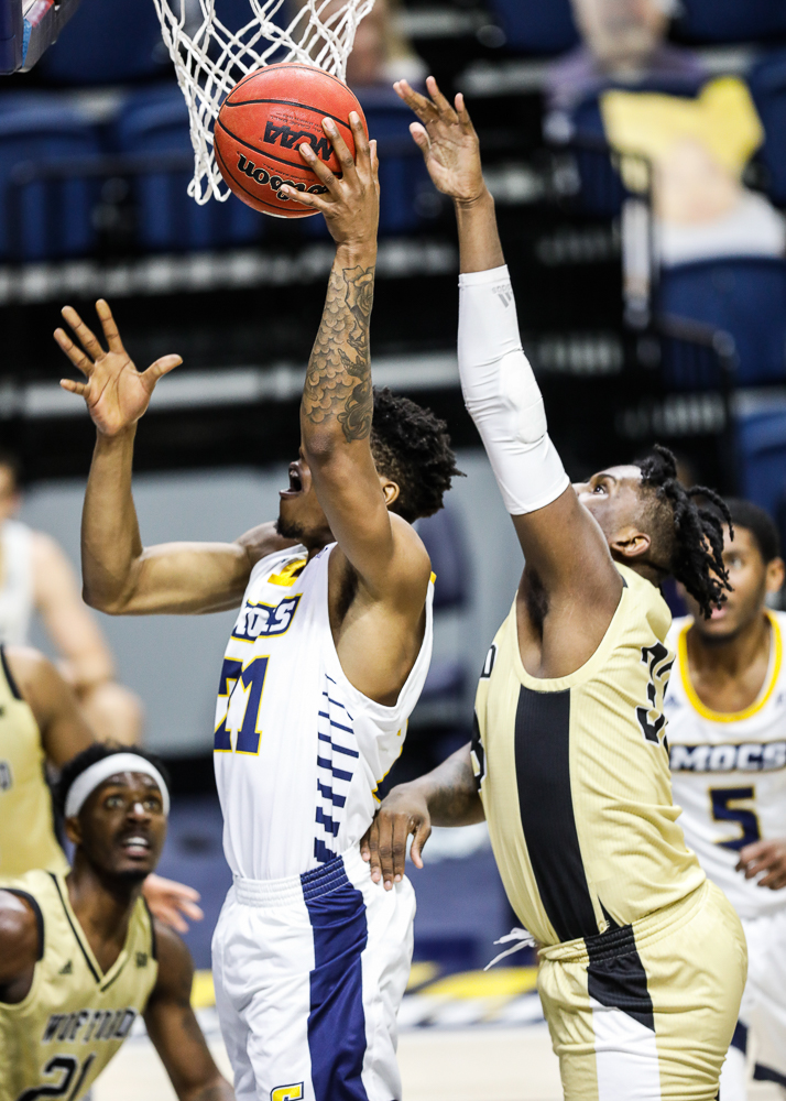 Staff photo by Troy Stolt / Chattanooga Mocs forward Josh Ayeni (21) shoots the ball during the UTC men's basketball game against Wofford at McKenzie Arena on Saturday, Jan. 16, 2021 in Chattanooga, Tenn.