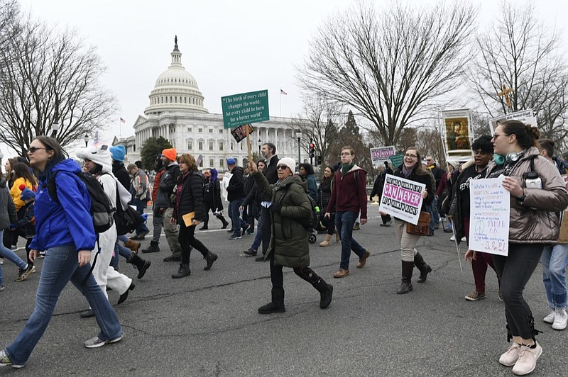 FILE - In this Friday, Jan. 24, 2020 file photo, anti-abortion activists participate in the "March for Life" rally near Capitol Hill in Washington. Organizers of the March for Life, the anti-abortion movement's preeminent annual event, are asking their supporters nationwide not to gather in Washington in 2021 due to the COVID-19 pandemic and political unrest. (AP Photo/Susan Walsh)


