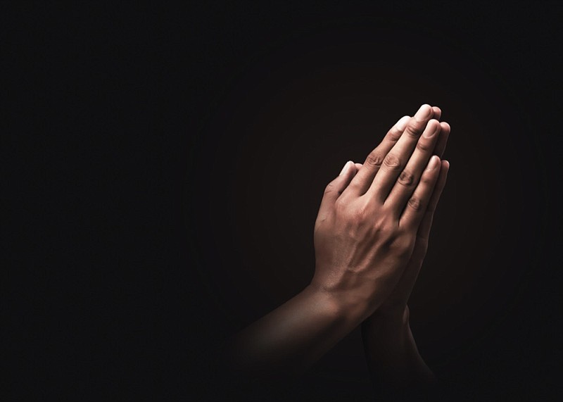 Praying hands with faith in religion / Getty Images