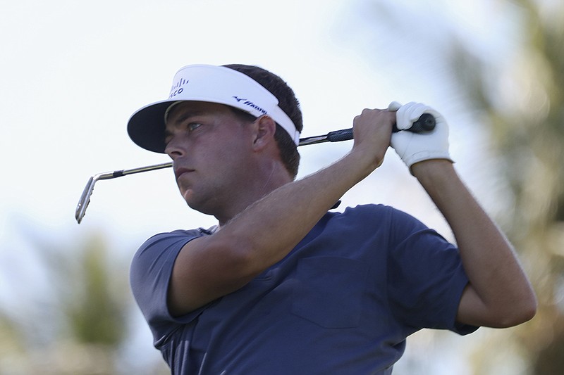 AP photo by Marco Garcia / Keith Mitchell follows his drive on the 11th tee during the third round of the Sony Open on Saturday in Honolulu. The Baylor School graduate shot a 63 and was tied for ninth, four shots out of the lead.