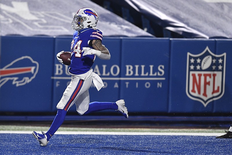 AP photo by Adrian Kraus / Buffalo Bills cornerback Taron Johnson returns an interception of the Baltimore Ravens' Lamar Jackson 101 yards for a touchdown in the divisional round of the NFL playoffs Saturday night in Orchard Park, N.Y. The Bills won 17-3 and will play for the AFC title for the first time since the 1993 season.