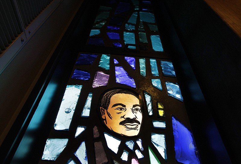 AP photo by Ted S. Warren / A stained glass window at Mount Zion Baptist Church bears the likeness of Martin Luther King Jr. on Jan. 13, 2012, during Seattle Community College's annual MLK community celebration.
