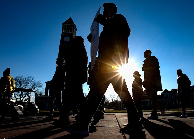 Staff photo by Troy Stolt / Bradley County residents march through Lee University's campus to honor Dr. Martin Luther King Jr. in Cleveland, Tenn. on Monday, Jan. 18, 2021.