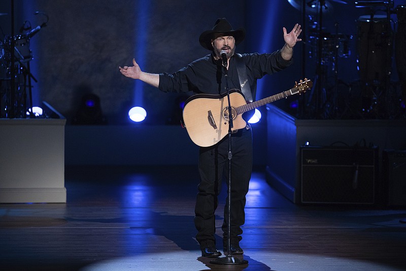 In this March 4, 2020, file photo, Garth Brooks performs on stage during the 2020 Gershwin Prize Honoree's Tribute Concert at the DAR Constitution Hall in Washington. (Photo by Brent N. Clarke/Invision/AP)