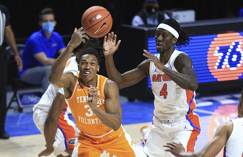 AP phot by Matt Stamey / Tennessee senior Yves Pons shoots with Florida's Anthony Duruji defending during Tuesday night's 75-49 loss to the Gators.