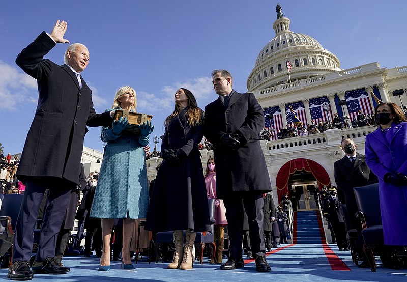 Associated Press photo by Andrew Harnik/Joe Biden is sworn in as the 46th president of the United States by Chief Justice John Roberts as Jill Biden holds the Bible during the 59th Presidential Inauguration at the U.S. Capitol in Washington on Wednesday.