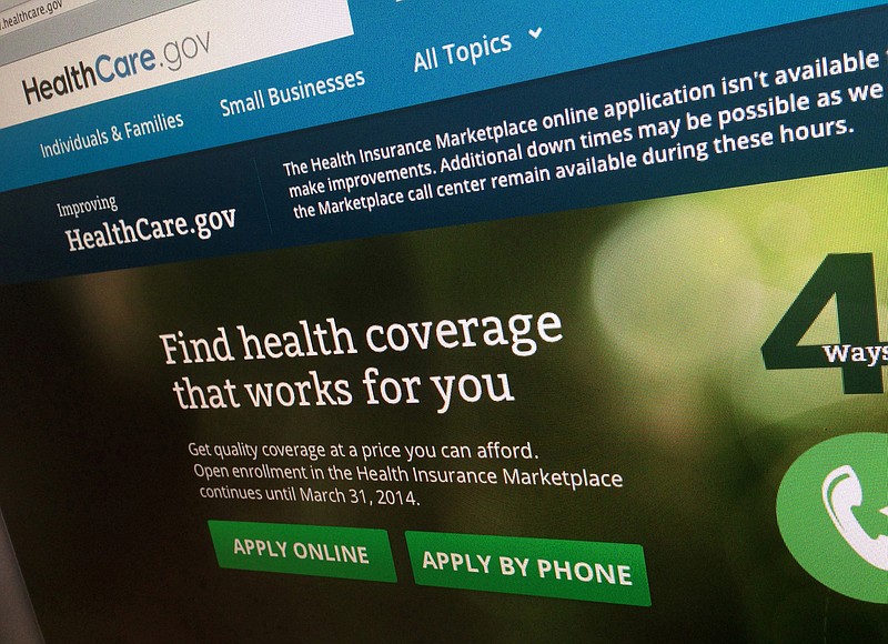 FILE - This Nov. 29, 2013 file photo shows part of the HealthCare.gov website, photographed in Washington. (AP Photo/Jon Elswick)