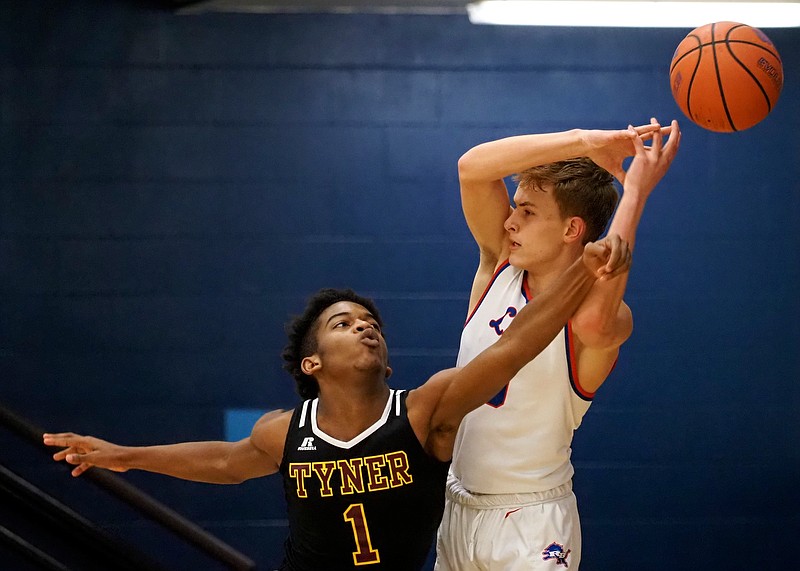 Staff photo by C.B. Schmelter / Tyner's Trent Gresham, left, steals the ball from Red Bank's Taylor Swanson during Thursday night's game at Red Bank.