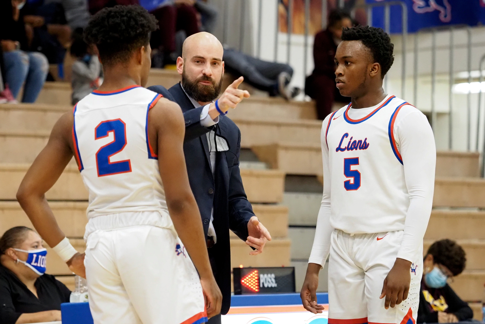 Staff photo by C.B. Schmelter / Red Bank coach Nick Fike talks to Ryan Barber (2) and Nick Smith (5) at Susan Ingram Thurman Gymnasium on the campus of Red Bank High School on Thursday, Jan. 21, 2021 in Chattanooga, Tenn.