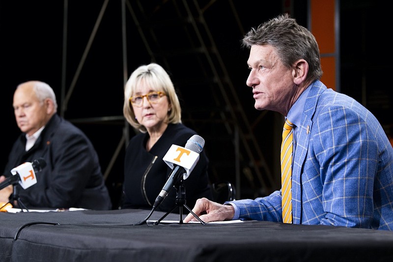 University of Tennessee System President Randy Boyd speaks during a press conference in Knoxville, Tenn., Monday, Jan. 18, 2021, as school chancellor Donde Plowman, center, and athletic director Phillip Fulmer, left, look on. Tennessee has fired football coach Jeremy Pruitt, two assistants and seven members of the Volunteers' recruiting and support staff for cause after an internal investigation found what the university chancellor called "serious violations of NCAA rules." (Brianna Paciorka/Knoxville News Sentinel via AP)