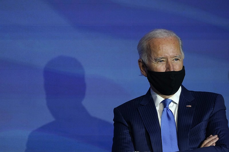 FILE - In this Dec. 11, 2020, file photo President-elect Joe Biden listens during an event to announce his choice for several positions in his administration at The Queen theater in Wilmington, Del. President-elect Joe Biden has a lot to accomplish in building out his administration. He is aiming for a historically diverse Cabinet without overlooking long-time allies in his party’s establishment. (AP Photo/Susan Walsh, File)