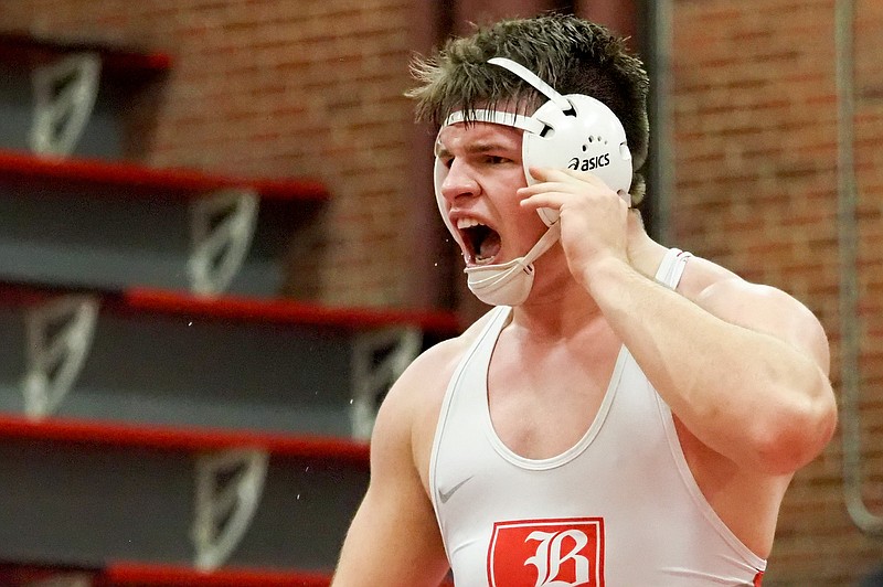 Staff photo by C.B. Schmelter / Baylor senior Heath Snodgrass celebrates his victory over McCallie's Carson Gentle at 220 pounds during Friday's match. Snodgrass won 8-6 to help his Red Raiders win 51-14 on senior night.