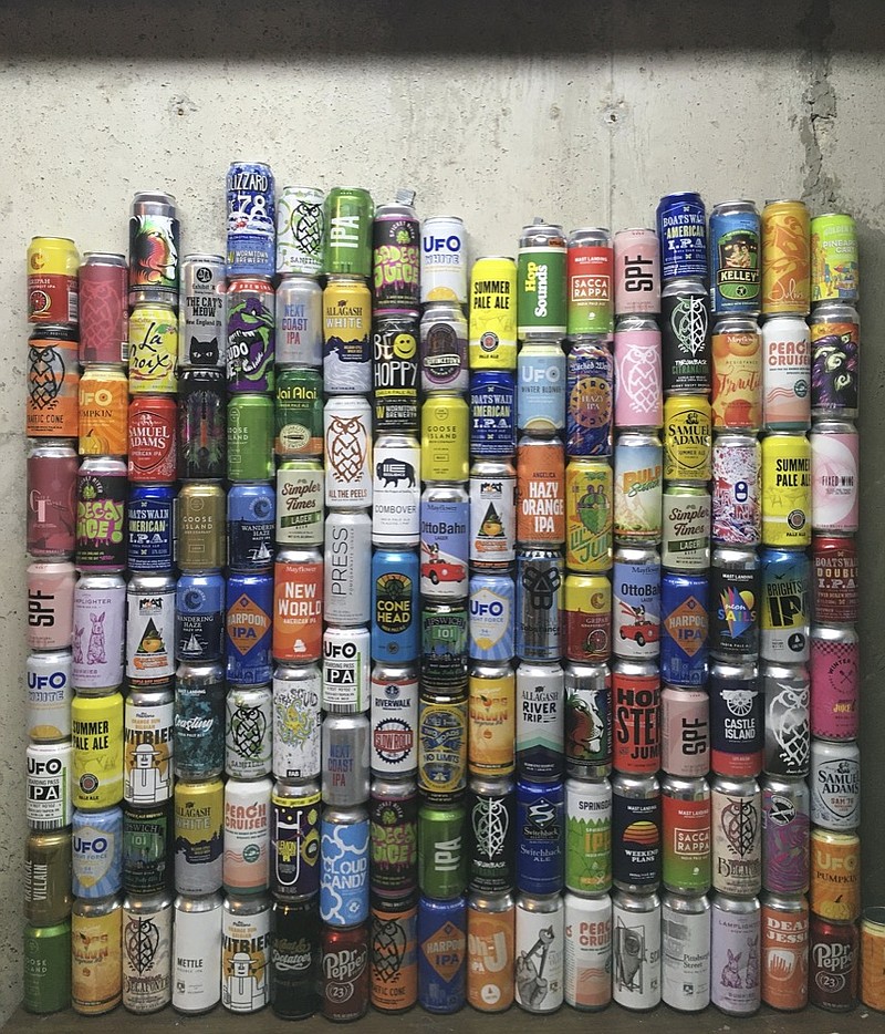 This Jan. 1, 2021 photo shows a collection of empty beer cans, consumed during the pandemic, at a home in North Andover, Mass. This year's Dry January came as many people had seen an uptick in their alcohol intake. Addiction treatment experts note that a month of forced sobriety might not have a lasting impact and could lead to binge drinking in February. But others believe the annual show of sobriety can't hurt. (Mary Schwalm via AP)


