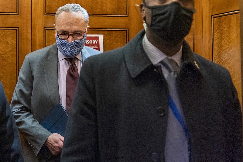 Senate Majority Leader Chuck Schumer of N.Y, takes the elevator in the U.S. Capitol , Friday, Jan. 22, 2021, in Washington. (AP Photo/Manuel Balce Ceneta)