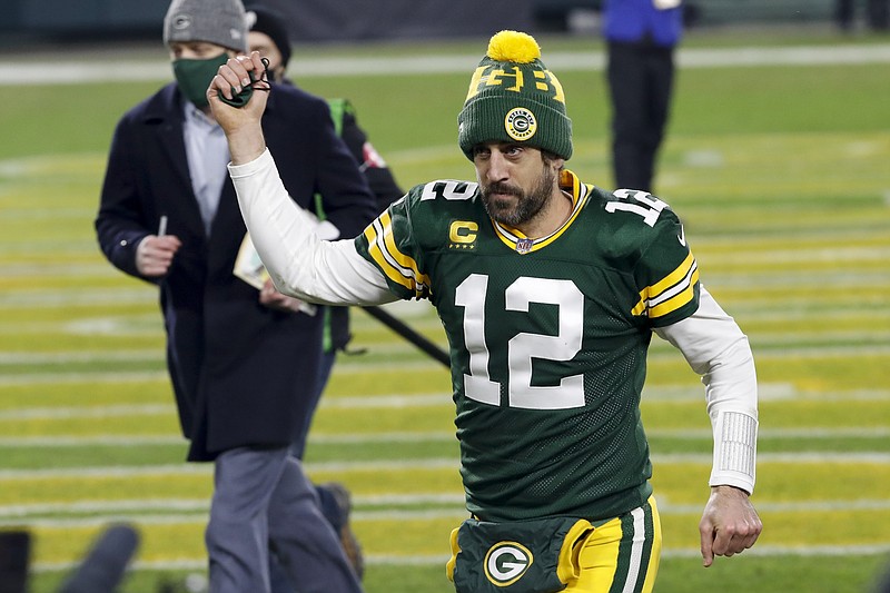 AP photo by Mike Roemer / Green Bay quarterback Aaron Rodgers pumps his fist after the Packers beat the visiting Los Angeles Rams 32-18 on Jan. 16 in the divisional round of the NFL playoffs. Now the top-seeded Packers will host the fifth-seeded Tampa Bay Buccaneers and quarterback Tom Brady in the NFC championship game.
